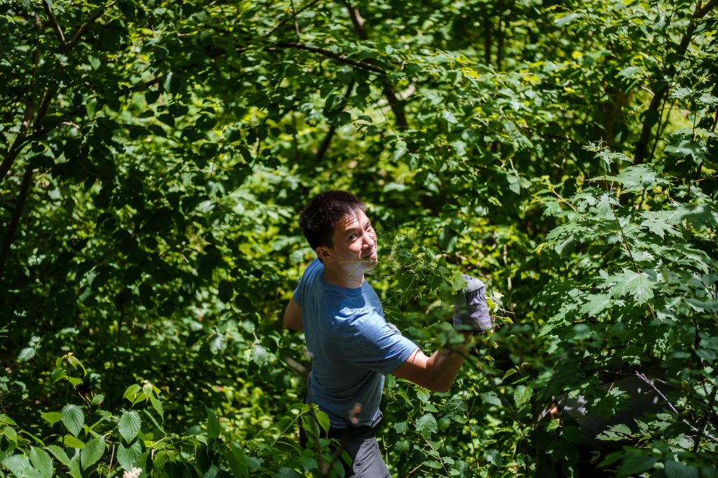 Our co-founder, Stephen, led by example and went right into the ravine to find more weeds.. 