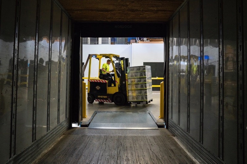 A picture of a warehouse loading dock, one of the hubs of supply chain logistics