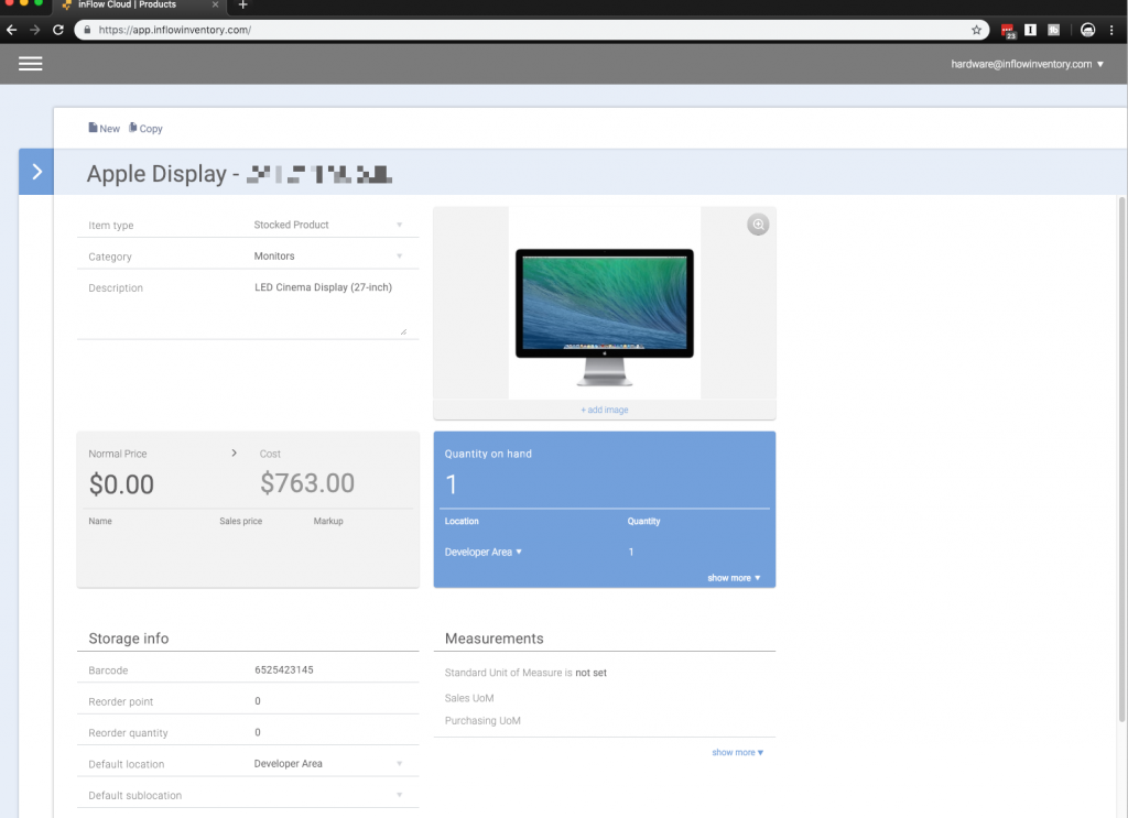 Screenshot of the inFlow Cloud web app being used for asset tracking with an Apple Cinema display