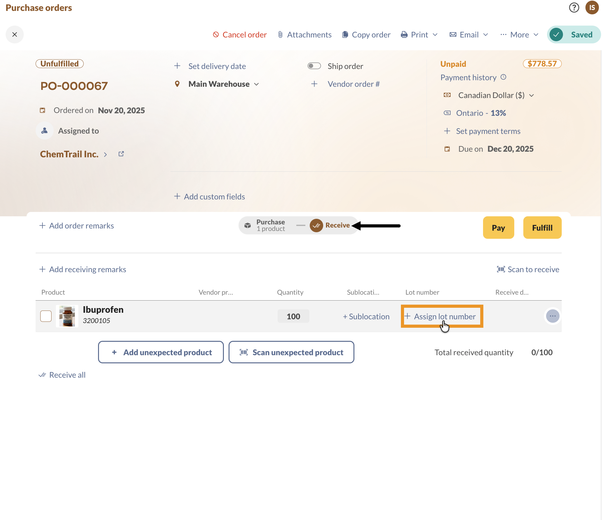 A purchase order on the Receive tab, with Assign lot number in the product line's Lot number column.